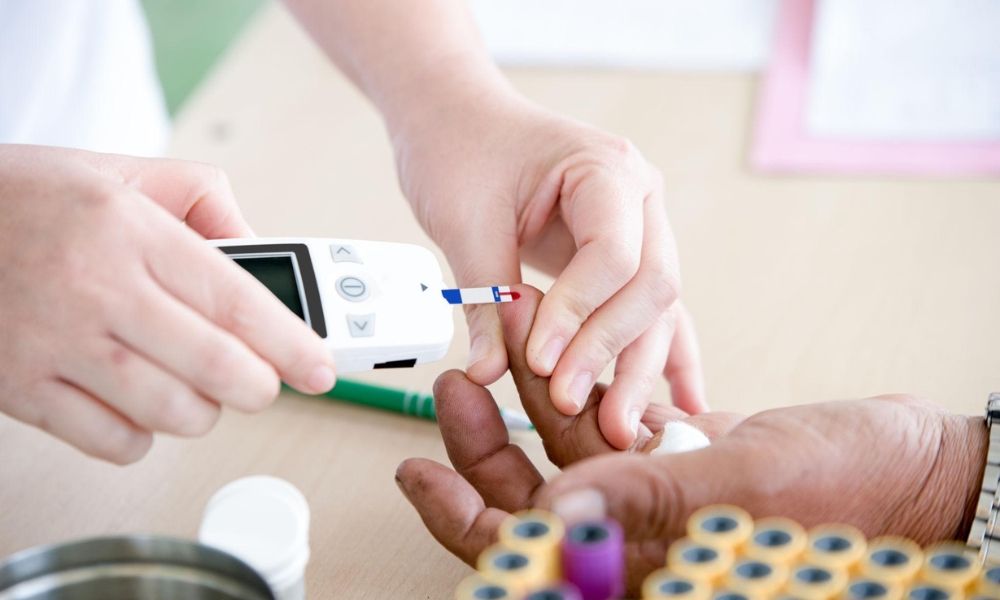 Doctor explaining blood sugar levels and diabetes management to a patient